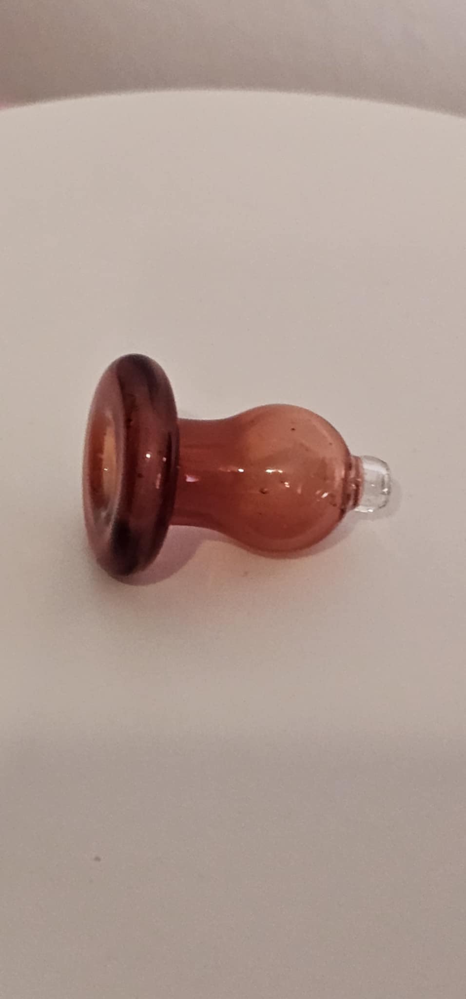 Close-up of PADD Glass Bubble Cap Ruby handcrafted borosilicate finish