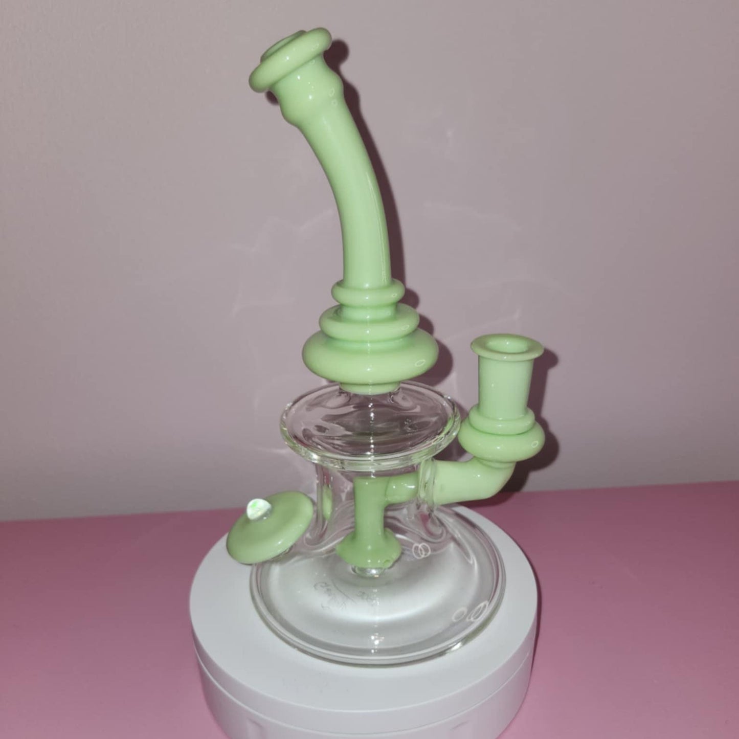 Close-up of opaque plastic surface on lime green hanger showing smooth molded texture and durable hook connection point for closet use