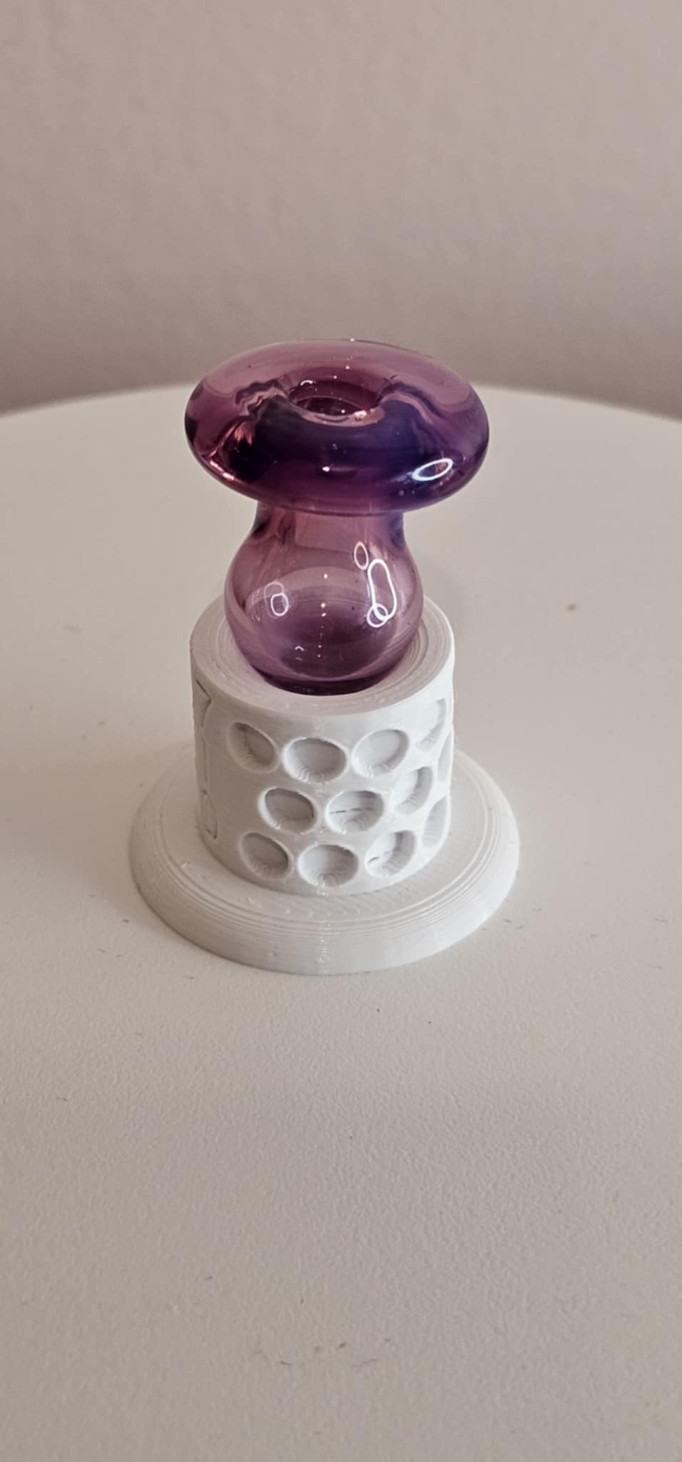 Karmaline Padd Glass bubble carb cap showing opalescent fuchsia shift on quartz banger
