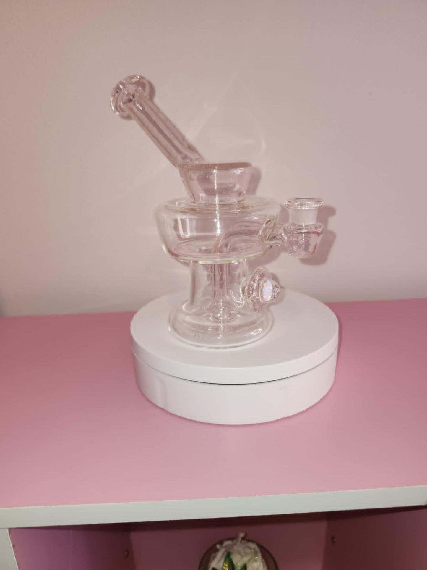 close-up of pink handblown glass showing smooth curves and detailed shaping of the urn chamber