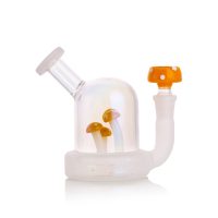 Terp Tube mushroom rig in yellow — four sculpted mushrooms with yellow tops inside a clear glass dome, matching shroom slide alongside
