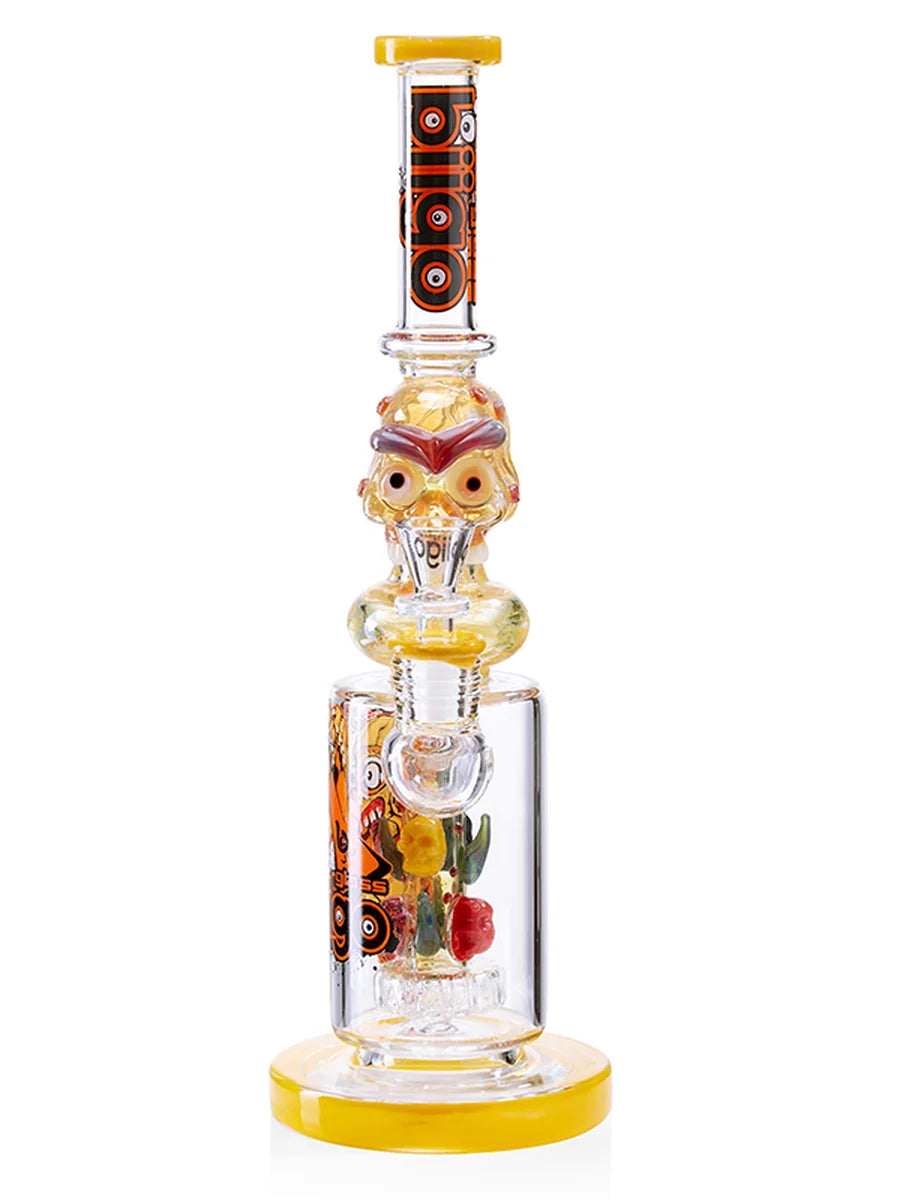 Yellow glass water pipe skull design in use during relaxed session showing smooth hits and aesthetic display piece